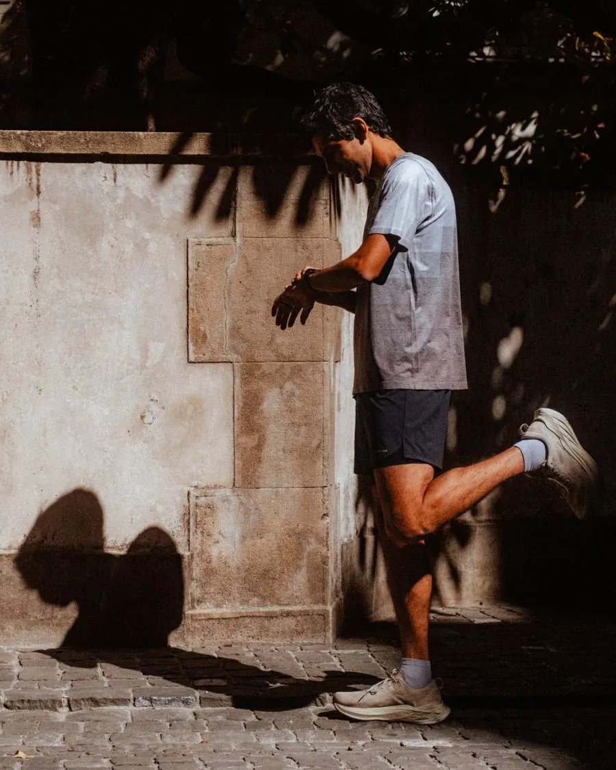 Amin checking his GPS watch during a session